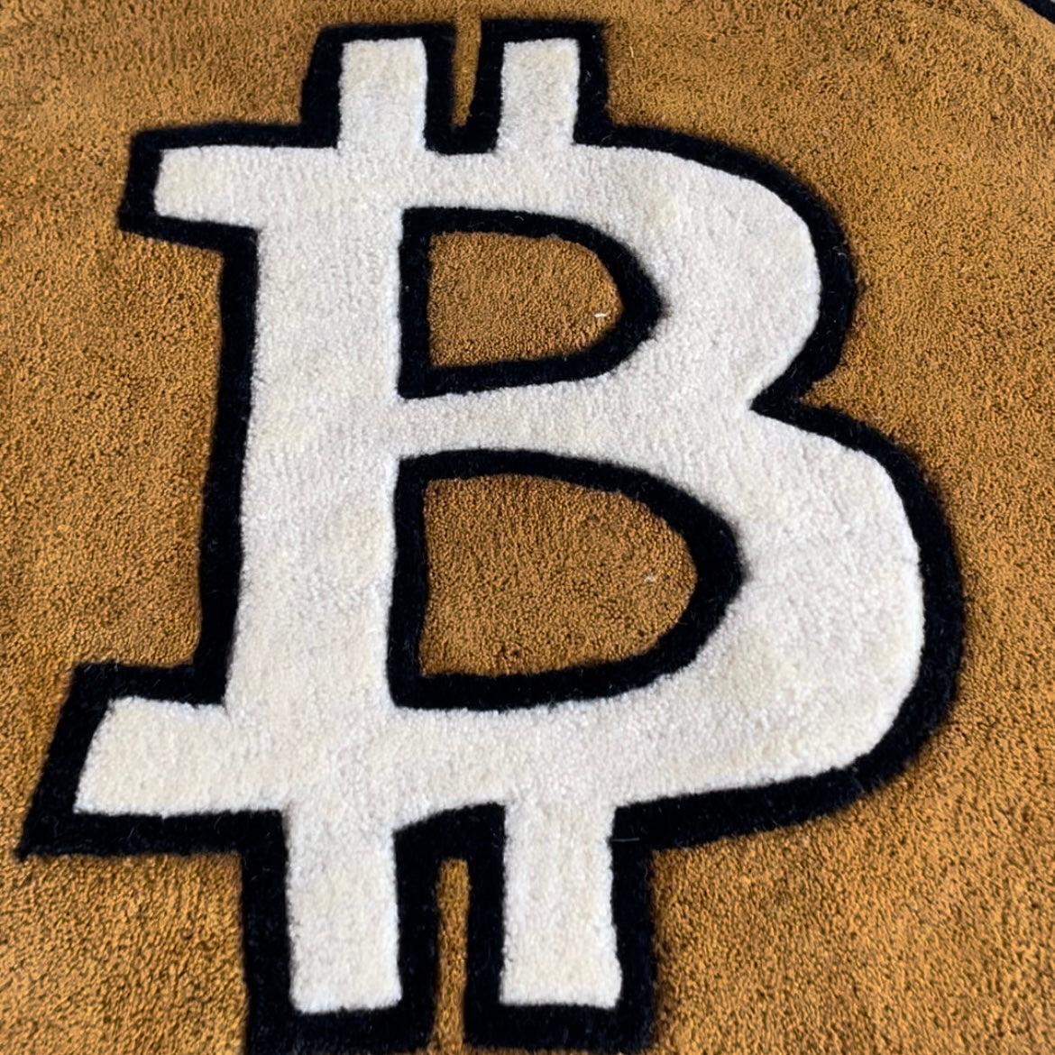 closeup of Bitcoin cryptocurrency symbol rug in signature orange and white colourway