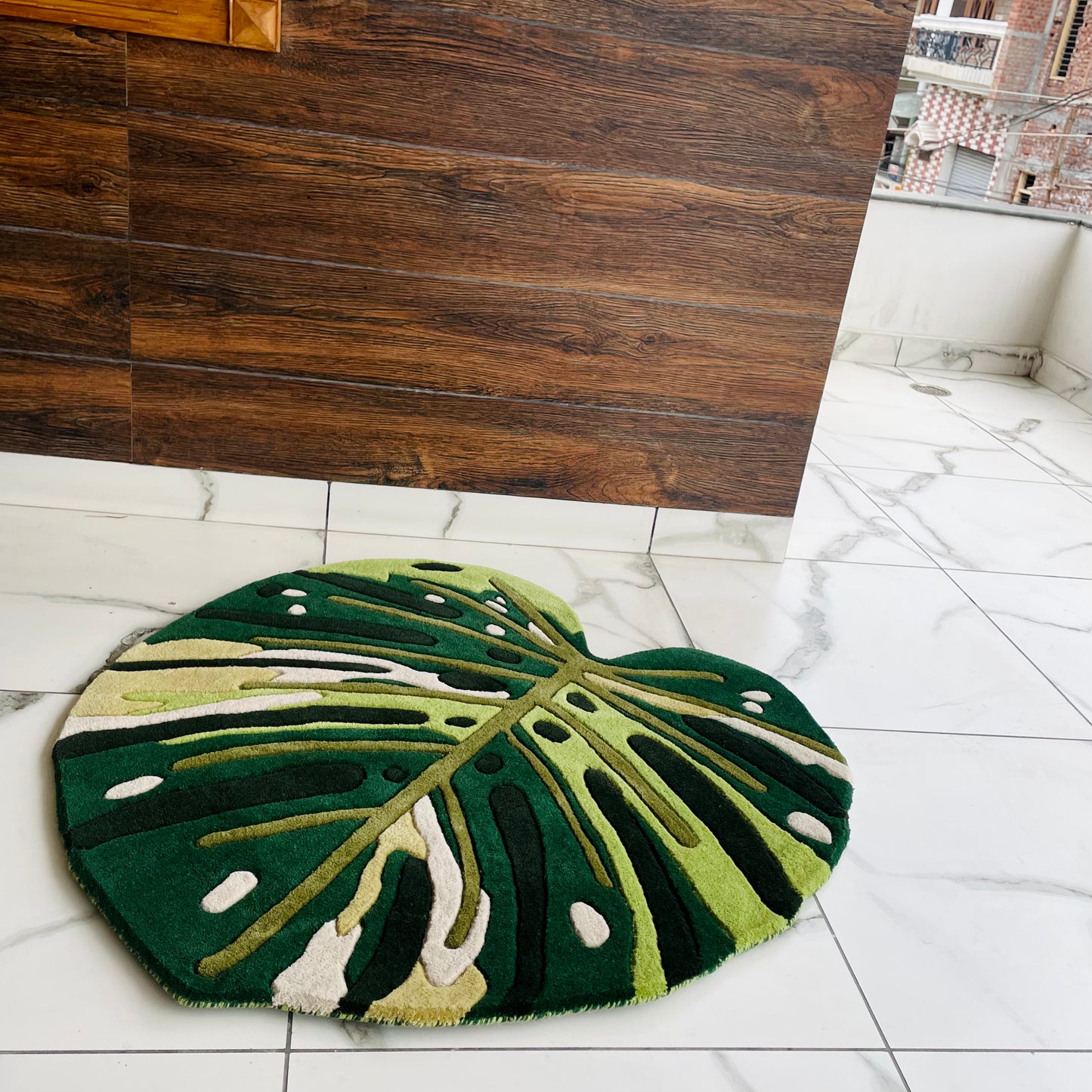 side view of Premium Monstera leaf rug showing thickness and crisp finishing
