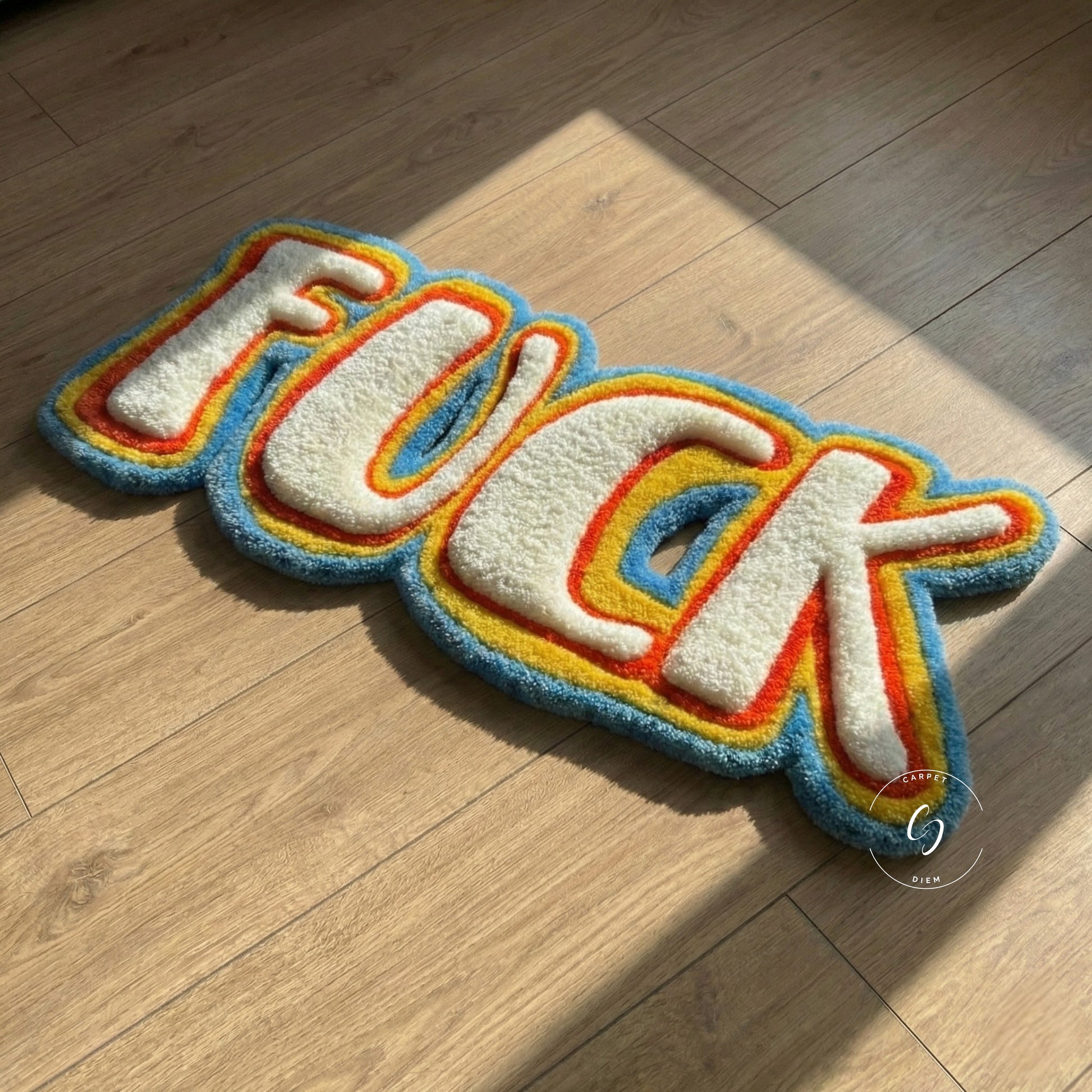 Colourful tufted rug with the word FUCK on a wooden floor