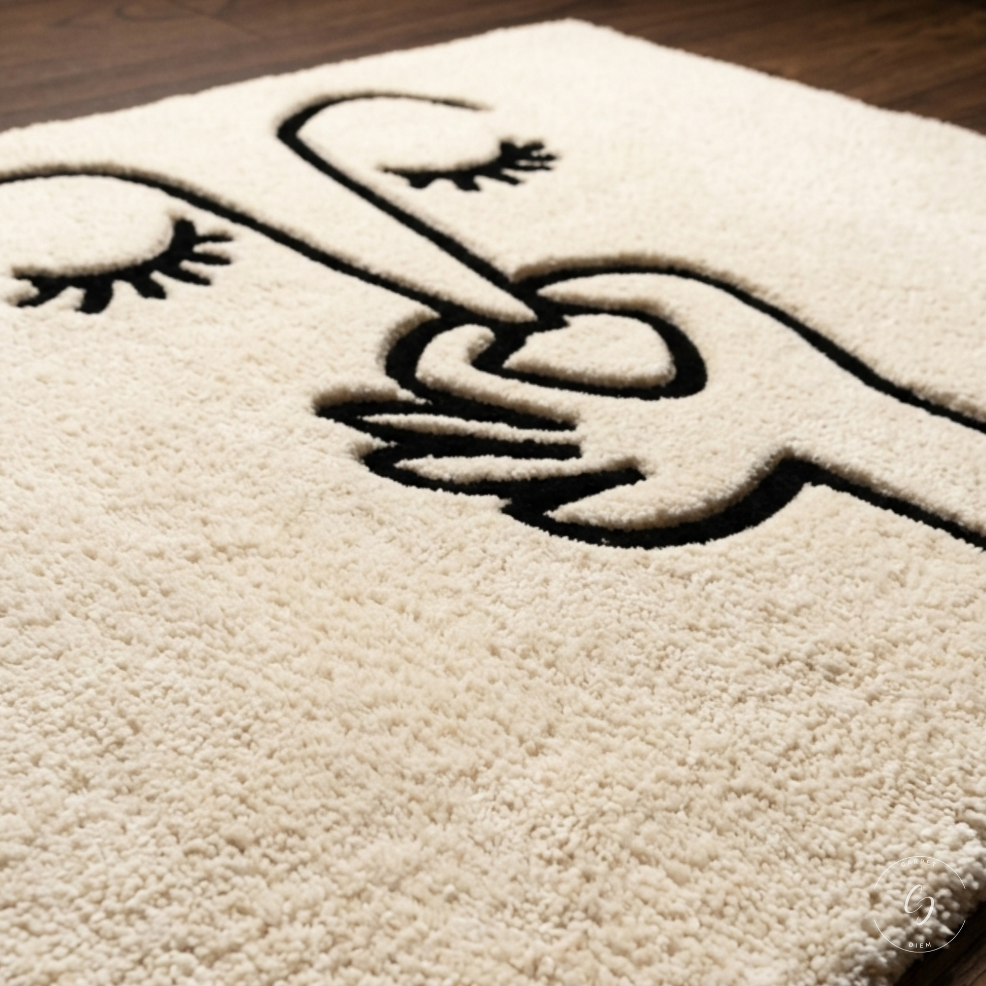 A close-up of a cream-coloured hand tufted bathroom entrance rug featuring a black embroidered design of a hand holding a heart-shaped finger, with eyelashes on the fingers.