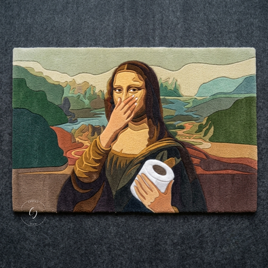 A rectangular woven hand tufted bathroom entrance rug featuring a parody art print of the Mona Lisa with a toilet paper roll, displayed flat against a dark gray textured background.