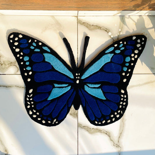 blue butterfly rug top view