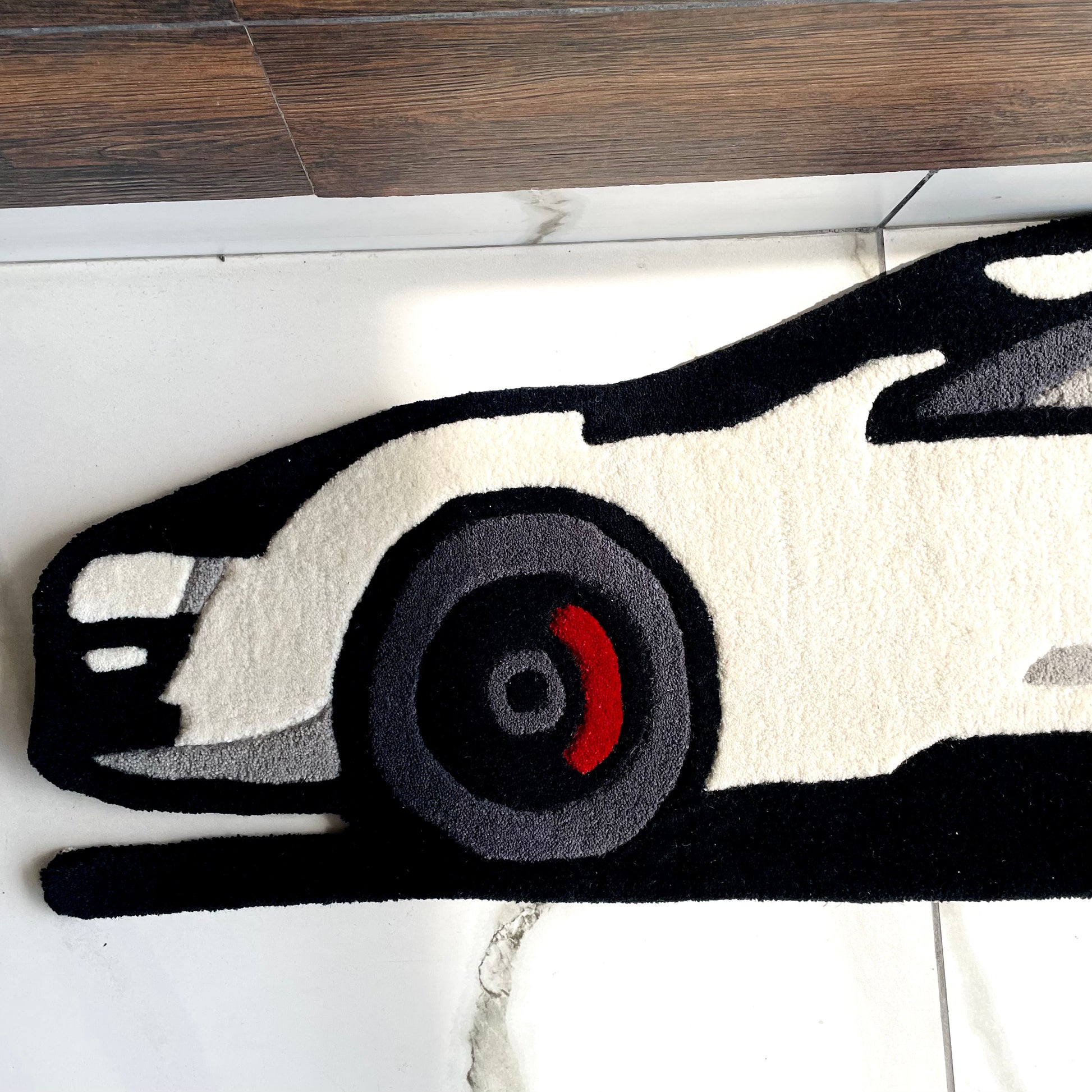 Hand-tufted Lykan HyperSport rug capturing supercar's front profile and luxury automotive aesthetics