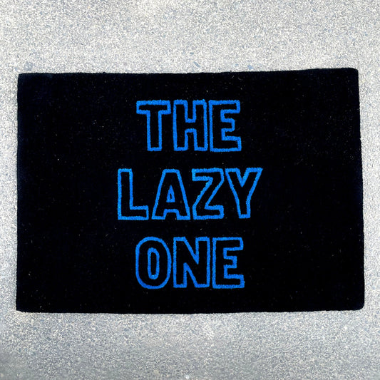 Contemporary hand-tufted typography The lazy one rug designed for relaxation and comfort